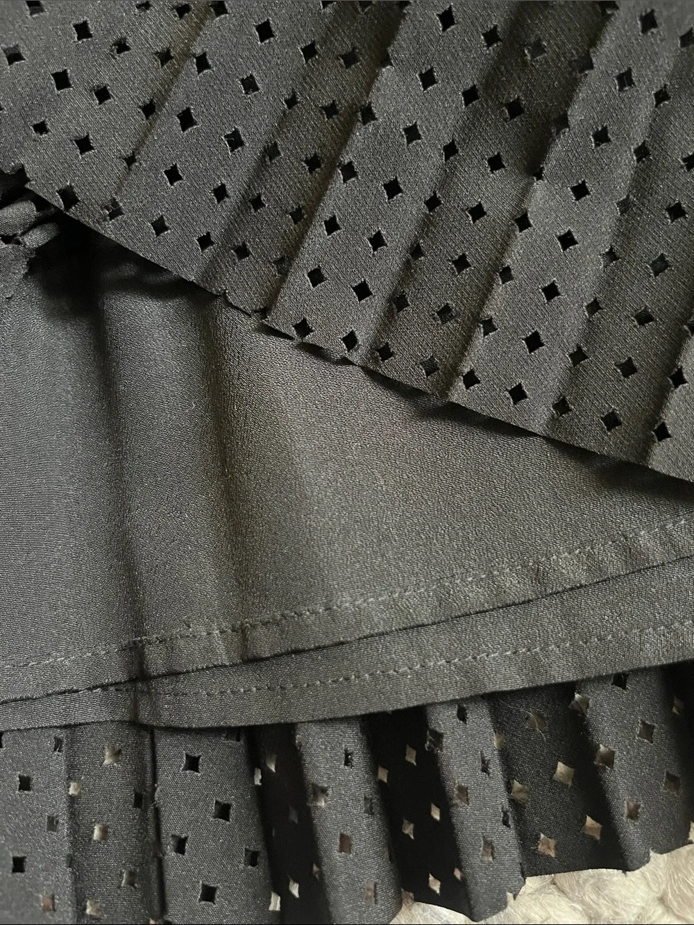 J. Crew black laser cut pleated A-line skirt.